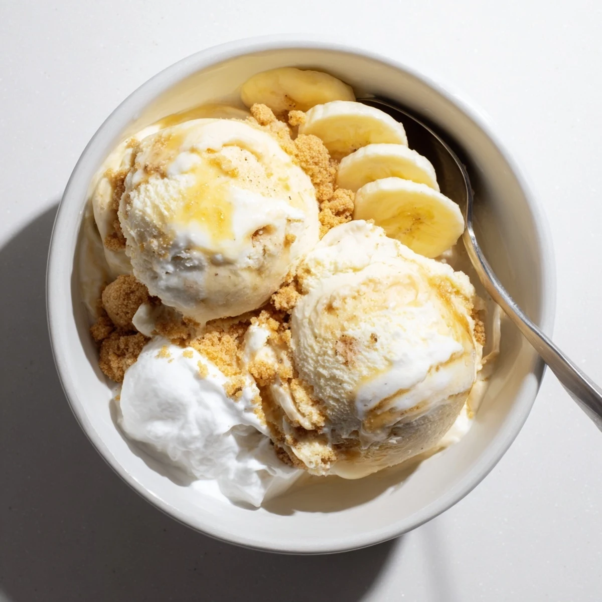 Creamy Ninja Creami Banana Cream Pie Ice Cream served in bowls, banana slices
