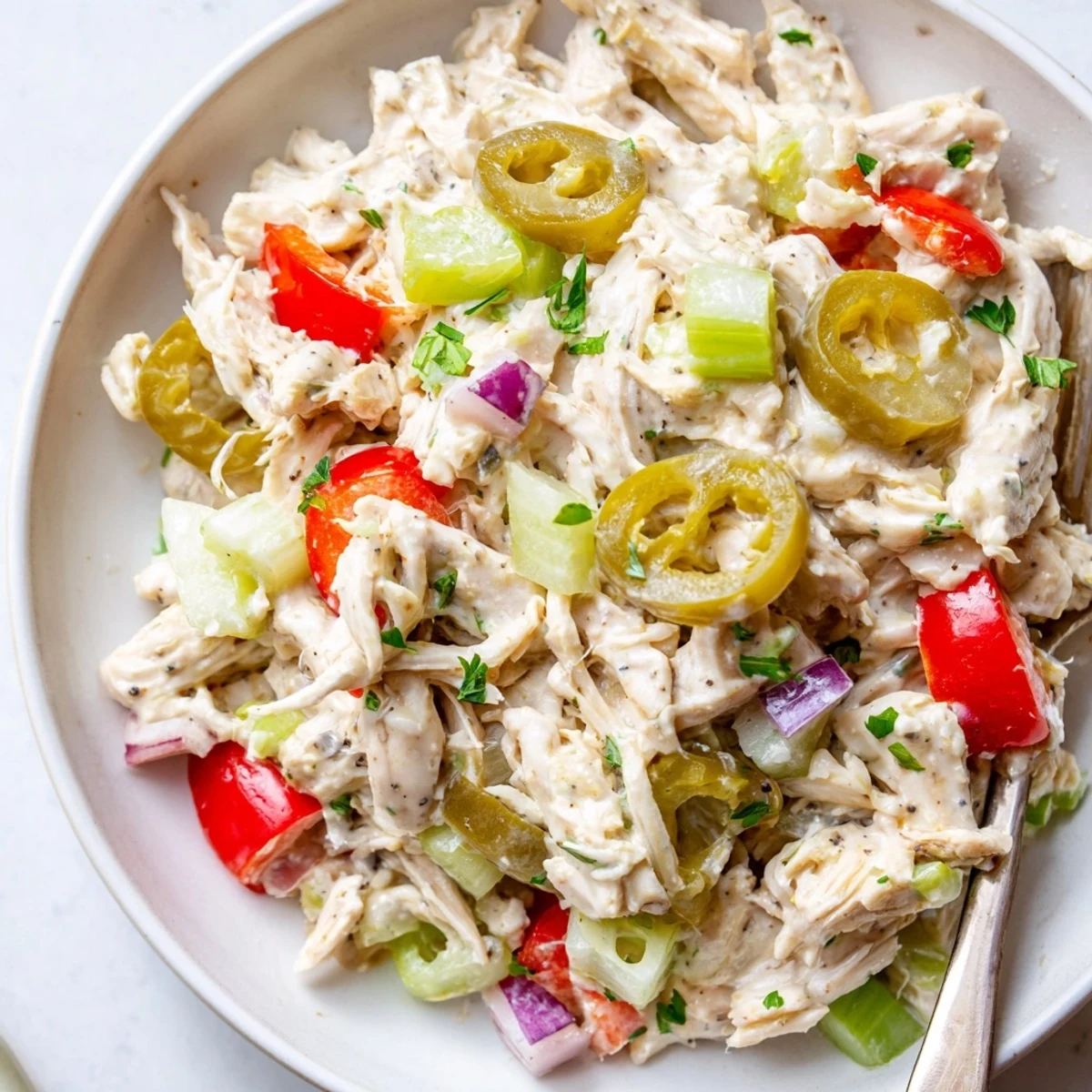 High Protein Pepperoncini Chicken Salad with tangy brine, creamy yogurt, crunchy celery.  