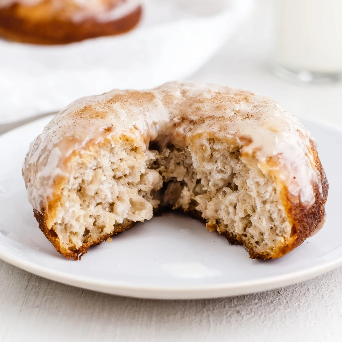 Fresh-baked Banana Donuts cooling on a wire rack, warm banana aroma