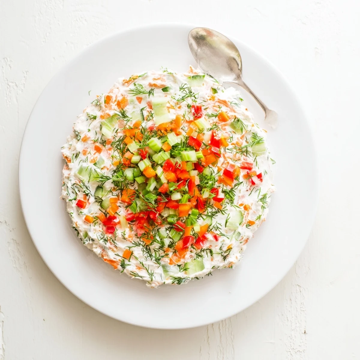 Colorful Garden Vegetable Spread Recipe in bowl, smooth cream cheese, herb flecks
