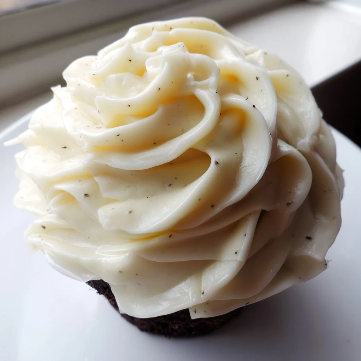 Creamy Italian meringue buttercream piped into elegant rosettes on a celebration cake