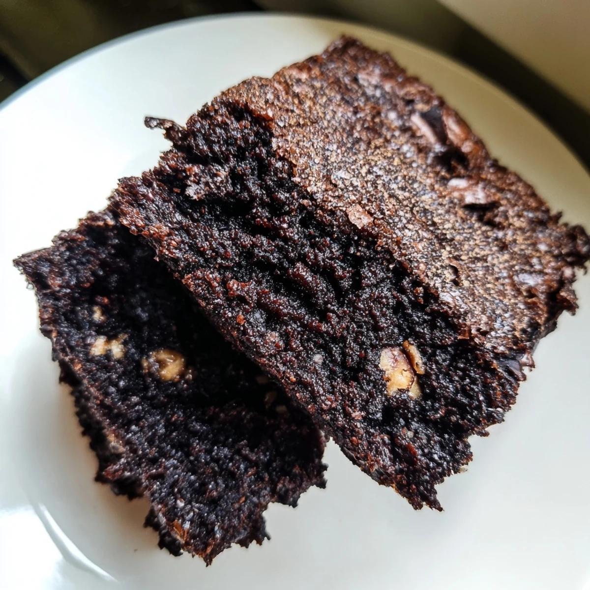 Fudgy homemade brownies with a shiny crackly top, sliced into squares